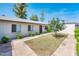Exterior of a well-kept home with landscaping, featuring a neat lawn and trimmed bushes at 3324 S Parkside Dr, Tempe, AZ 85282
