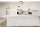 The kitchen features light colored cabinets, stainless steel appliances, and a breakfast bar at 3324 S Parkside Dr, Tempe, AZ 85282
