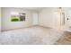 Bright and spacious living room with neutral carpet and ample natural light at 3324 S Parkside Dr, Tempe, AZ 85282