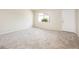 Bright and spacious living room with neutral carpet and ample natural light at 3324 S Parkside Dr, Tempe, AZ 85282
