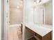 View into the main bathroom with vanity, tile flooring and shower and tub combo at 3324 S Parkside Dr, Tempe, AZ 85282