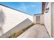 Exterior patio with privacy fence, neutral wall and a metal gate at 3324 S Parkside Dr, Tempe, AZ 85282