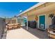 Covered back patio features a picnic table and a grill at 3447 E Dolphin Ave, Mesa, AZ 85204