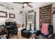 This bedroom includes a closet, a window, sports decor, and two comfy armchairs at 3447 E Dolphin Ave, Mesa, AZ 85204