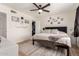 Spacious bedroom features ceiling fan, closet, and natural light from a large window at 3447 E Dolphin Ave, Mesa, AZ 85204