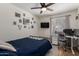 Nicely decorated bedroom with ceiling fan and desk at 3447 E Dolphin Ave, Mesa, AZ 85204