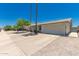 Home featuring a well-maintained front yard, driveway, and attached garage at 3447 E Dolphin Ave, Mesa, AZ 85204