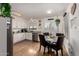 Bright kitchen with stainless steel appliances, white cabinetry, and dining area at 3447 E Dolphin Ave, Mesa, AZ 85204
