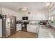Well-lit kitchen with stainless steel appliances and granite countertops at 3447 E Dolphin Ave, Mesa, AZ 85204