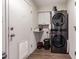 Functional laundry room featuring a stacked washer and dryer unit at 3447 E Dolphin Ave, Mesa, AZ 85204