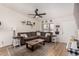 Inviting living room featuring a comfortable sofa, modern ceiling fan and updated decor at 3447 E Dolphin Ave, Mesa, AZ 85204