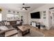 Inviting living room featuring a cozy sofa, modern ceiling fan and updated decor at 3447 E Dolphin Ave, Mesa, AZ 85204
