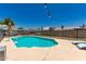 Inviting in-ground pool with lounge chairs and well-maintained patio area, perfect for outdoor relaxation at 3447 E Dolphin Ave, Mesa, AZ 85204