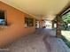 Relaxing covered patio with brick flooring and a ceiling fan at 3740 E Mercer Ln, Phoenix, AZ 85028