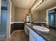 Bathroom features a double sink vanity with granite countertop and tiled floors at 3740 E Mercer Ln, Phoenix, AZ 85028