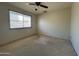 Bedroom featuring neutral carpet and a window offering natural lighting at 3740 E Mercer Ln, Phoenix, AZ 85028