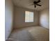 Bedroom with neutral carpet and window, offering natural light and space at 3740 E Mercer Ln, Phoenix, AZ 85028
