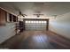 Spacious garage with ample storage and a functional ceiling fan at 3740 E Mercer Ln, Phoenix, AZ 85028