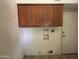 Convenient laundry area with hookups and storage at 3740 E Mercer Ln, Phoenix, AZ 85028