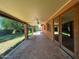 Covered brick patio extends along the back of the house, leading to backyard at 3740 E Mercer Ln, Phoenix, AZ 85028