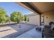 This inviting backyard features a patio, mature landscaping and an area for outdoor gatherings at 3925 E Elmwood St, Mesa, AZ 85205