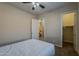 Spacious bedroom with neutral walls, a ceiling fan, and ample space for relaxation at 3925 E Elmwood St, Mesa, AZ 85205