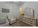 Charming Bedroom with neutral decor, including a crib, dresser, and comfortable seating at 3925 E Elmwood St, Mesa, AZ 85205