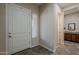 Welcoming entryway with tile flooring, white door, and light-filled window at 3925 E Elmwood St, Mesa, AZ 85205