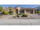 Charming single-story home with a well-manicured yard and a two-car garage at 3925 E Elmwood St, Mesa, AZ 85205