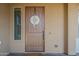 Inviting front door with tan accents and a decorative wreath at 3925 E Elmwood St, Mesa, AZ 85205