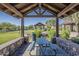 A community gazebo with seating, views of the green lawn and nearby amenities for outdoor gatherings at 3925 E Elmwood St, Mesa, AZ 85205