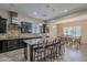 Open kitchen with large island, pendant lighting, and stainless steel range hood at 3925 E Elmwood St, Mesa, AZ 85205