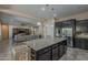 Modern kitchen with an island, stainless steel appliances, and open layout at 3925 E Elmwood St, Mesa, AZ 85205