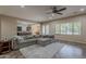 Spacious living room with an open layout, sectional sofa, and natural light, perfect for gatherings at 3925 E Elmwood St, Mesa, AZ 85205