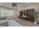 Open living room with a large entertainment center and natural light at 3925 E Elmwood St, Mesa, AZ 85205