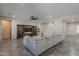Open living area showcasing a large sectional sofa, a wooden entertainment center, and neutral decor for a cozy feel at 3925 E Elmwood St, Mesa, AZ 85205