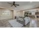 Inviting living room featuring a comfortable sectional sofa and a glimpse into the adjacent modern kitchen at 3925 E Elmwood St, Mesa, AZ 85205