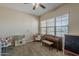 Inviting playroom with a piano, large window offering natural light, and playful décor for enjoyment at 3925 E Elmwood St, Mesa, AZ 85205