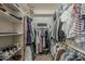 Walk-in closet with ample shelving, clothing racks, and storage for organization at 3925 E Elmwood St, Mesa, AZ 85205
