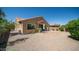 The home features a spacious backyard with a paved patio and desert landscaping at 3994 E Grand Canyon Pl, Chandler, AZ 85249