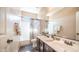 Bright bathroom features a double vanity, shower-tub combo, and vanity lights at 3994 E Grand Canyon Pl, Chandler, AZ 85249