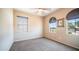 Neutral bedroom with two windows, carpet flooring, ceiling fan, and neutral colored walls at 3994 E Grand Canyon Pl, Chandler, AZ 85249