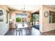 Well-lit dining room offers a sliding door to the backyard and neighborhood views from the window at 3994 E Grand Canyon Pl, Chandler, AZ 85249