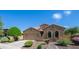 Charming single-story home featuring arched windows, a two-car garage, and well-maintained desert landscaping at 3994 E Grand Canyon Pl, Chandler, AZ 85249
