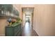 Inviting hallway with neutral walls, tile flooring, and decorative furniture, leading to other rooms at 3994 E Grand Canyon Pl, Chandler, AZ 85249