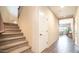 Hallway with carpeted staircase, a closet door, and views into the living room at 3994 E Grand Canyon Pl, Chandler, AZ 85249