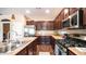 Functional kitchen featuring stainless steel appliances, a center island with a sink, and ample cabinet space at 3994 E Grand Canyon Pl, Chandler, AZ 85249
