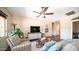 Cozy living area featuring a comfortable armchair, stylish decor, and a ceiling fan at 3994 E Grand Canyon Pl, Chandler, AZ 85249