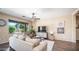Comfortable living room with a large window, stylish furniture, and natural light at 3994 E Grand Canyon Pl, Chandler, AZ 85249