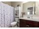 Cozy bathroom with shower-tub combo, cabinet, and vanity with sink at 4061 N 308Th Ln, Buckeye, AZ 85396